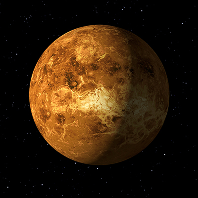 A detailed, orange-yellow planet with a mottled, cloudy surface appears against a black starry background, representing the planet Venus in space.