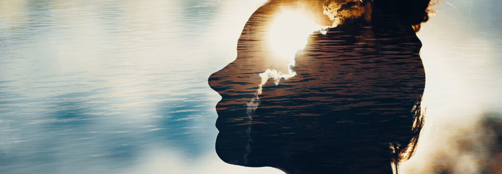 A double exposure image shows a person's silhouette in profile with sunlight to represent an abstract image of vibratory attunement.